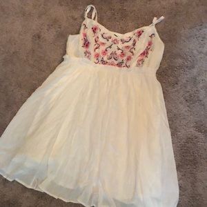 White dress with embroidery on front
